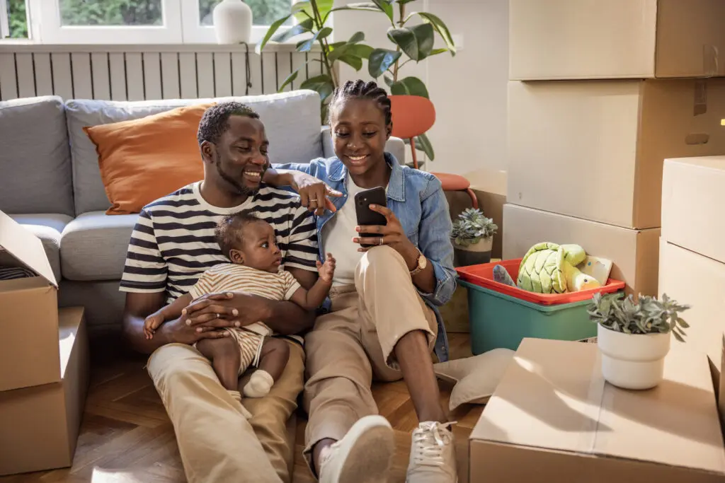 couple with baby in their new home