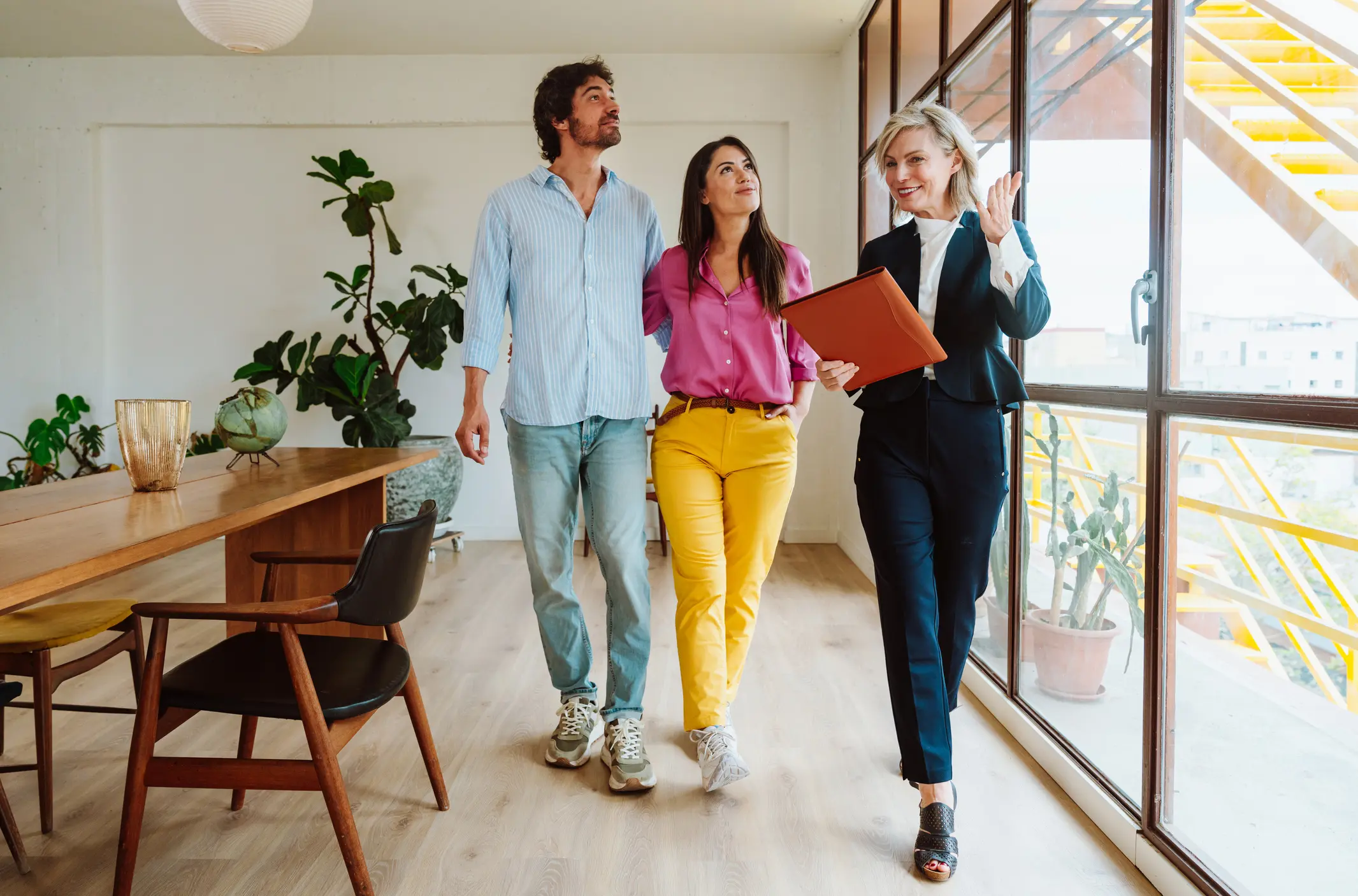 real estate agent showing an apartment to a couple.