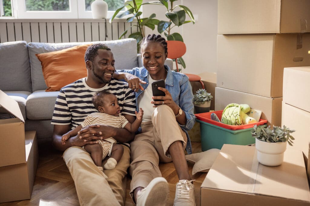 couple with baby in their new home